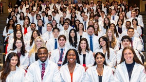 Members of the Class of 2028 smile during their White Coat Ceremony.